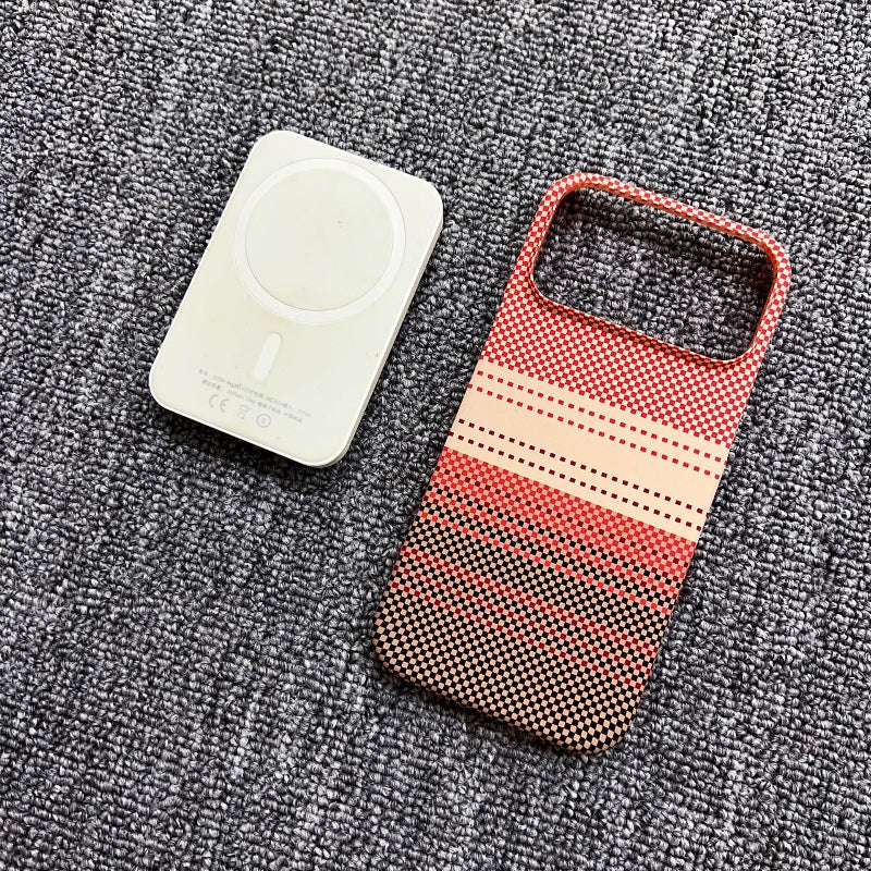 Red and beige patterned phone case on a textured gray surface