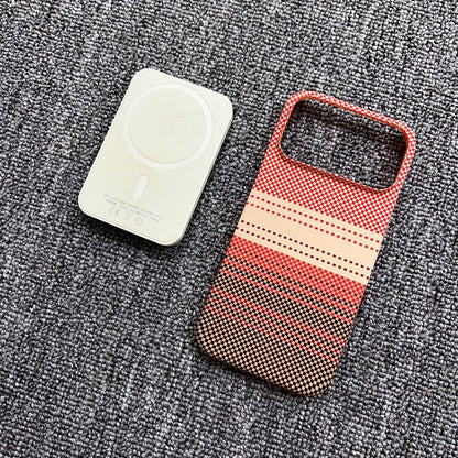 Red and beige patterned phone case on a textured gray surface