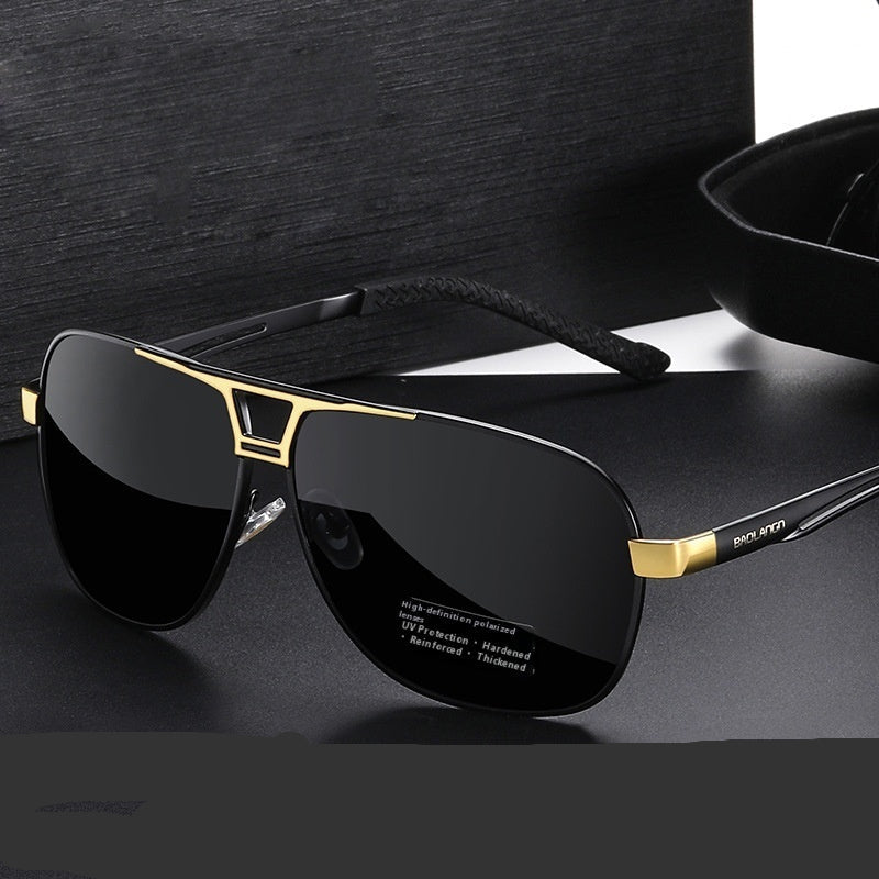 Black sunglasses with gold frames on a dark surface, text indicating high-definition polarized quality.