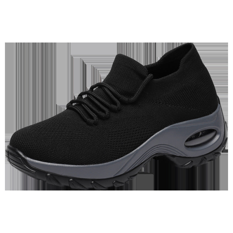 Black sneaker with gray sole on a white background