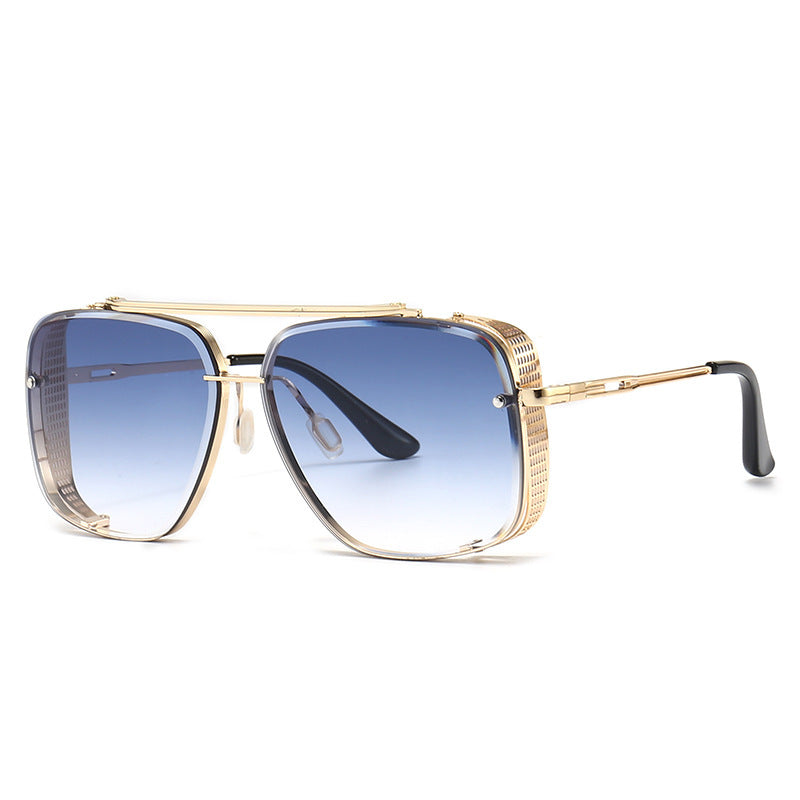 Gold-framed sunglasses with blue gradient lenses on a white background