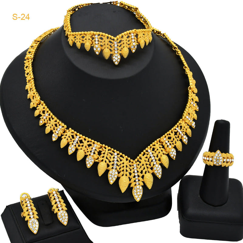 Gold-tone rhinestone necklace with fringe collar detail and stud earrings, ring