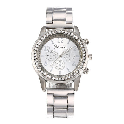 Silver wristwatch with gemstone accents on a white background