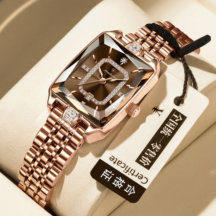 Rose gold watch with diamond accents on a beige surface, accompanied by a tag.