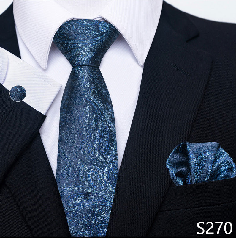 Blue paisley tie and pocket square set with black suit and white shirt