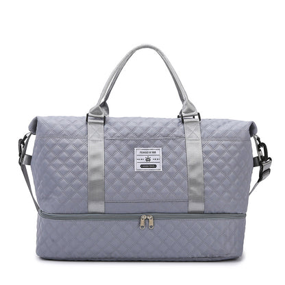 Light lavender quilted travel bag with front zip and matching crossbody pouch