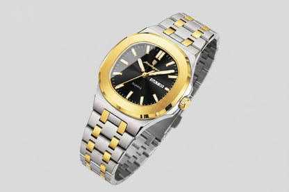 Luxury watch with gold and silver band on a beige background