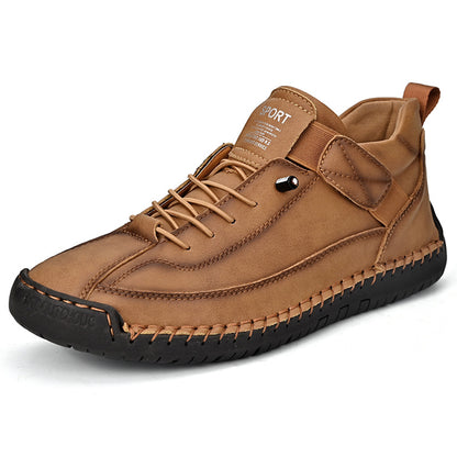 Men's mid-top leather lace-up shoe in brown/tan with metal eyelet detail and rubber sole.