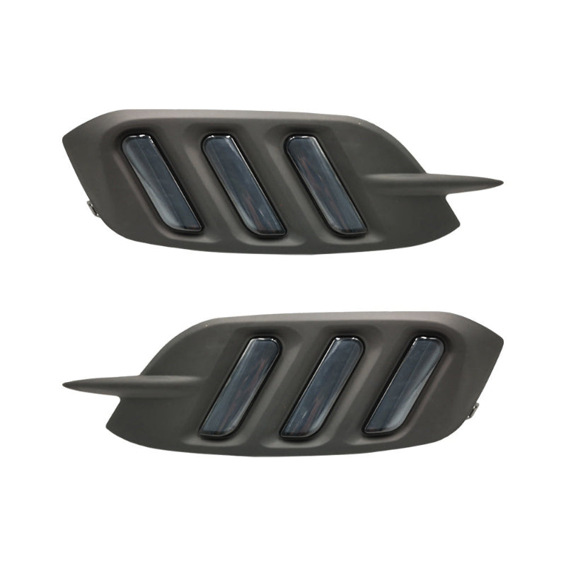 Two black car air intakes on a white background