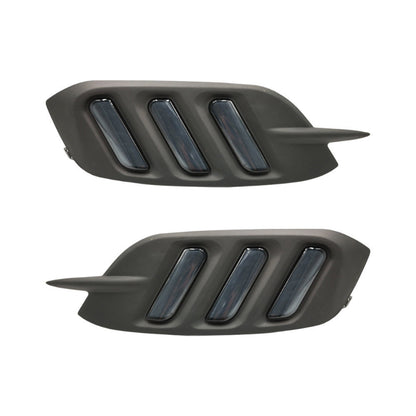 Two black car air intakes on a white background
