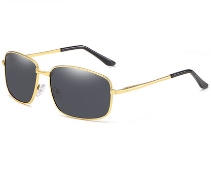 Gold-framed sunglasses with black lenses on a white background