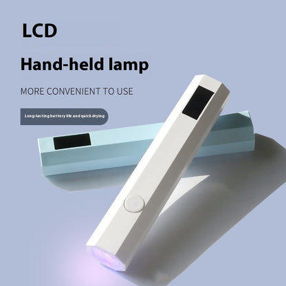 Hand-held lamp with LCD display on a light blue background