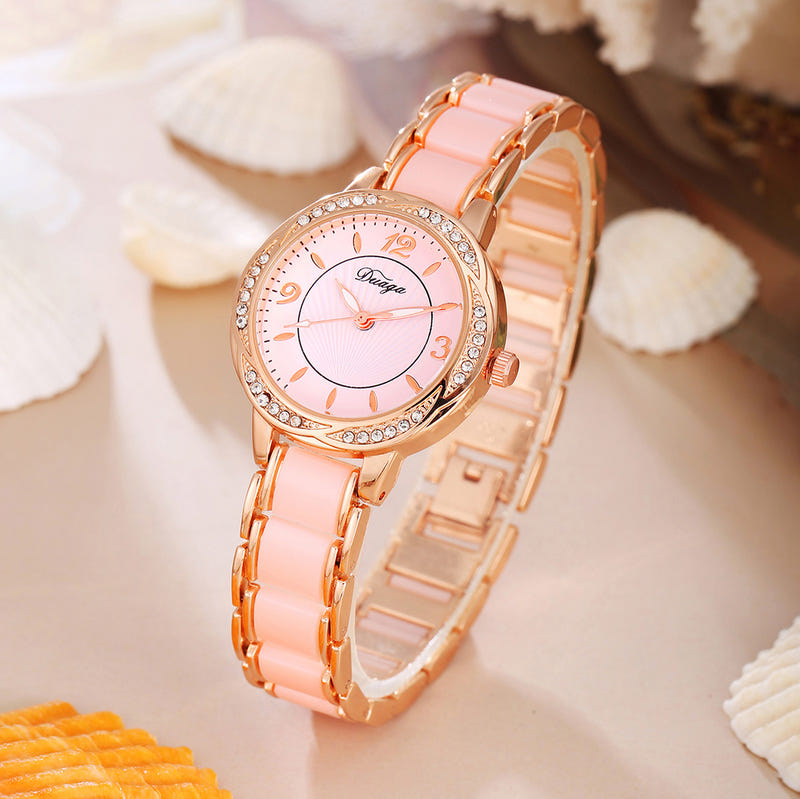 Rose gold round quartz wristwatch with pale pink dial and light pink link bracelet