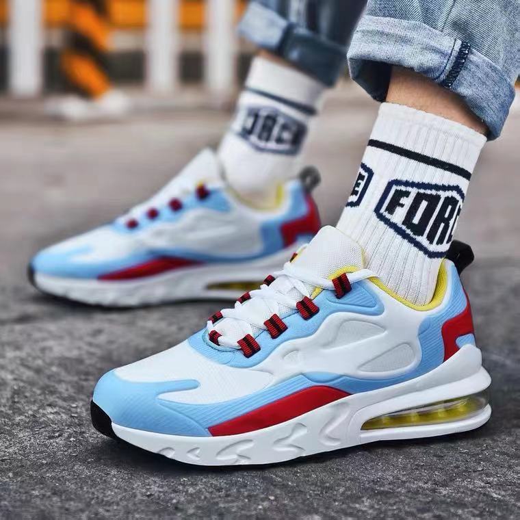 Colorful sneakers with red, blue, and white design on a blurred street background