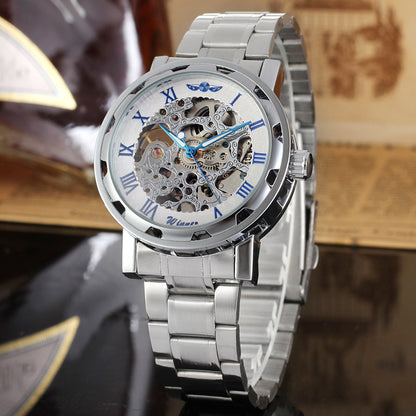 Silver wristwatch with a detailed mechanical design on a blurred background
