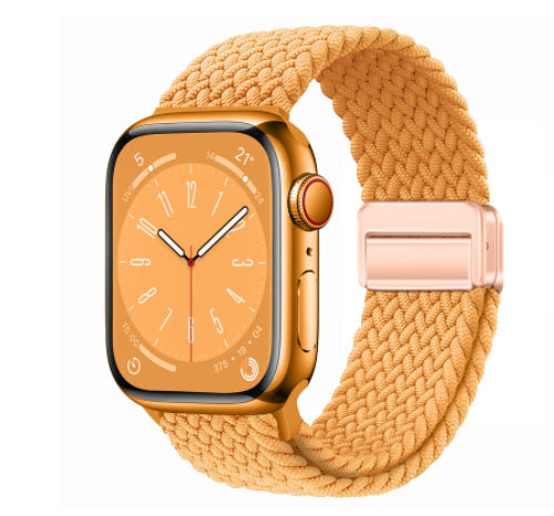 Smartwatch with a gold band on a white background