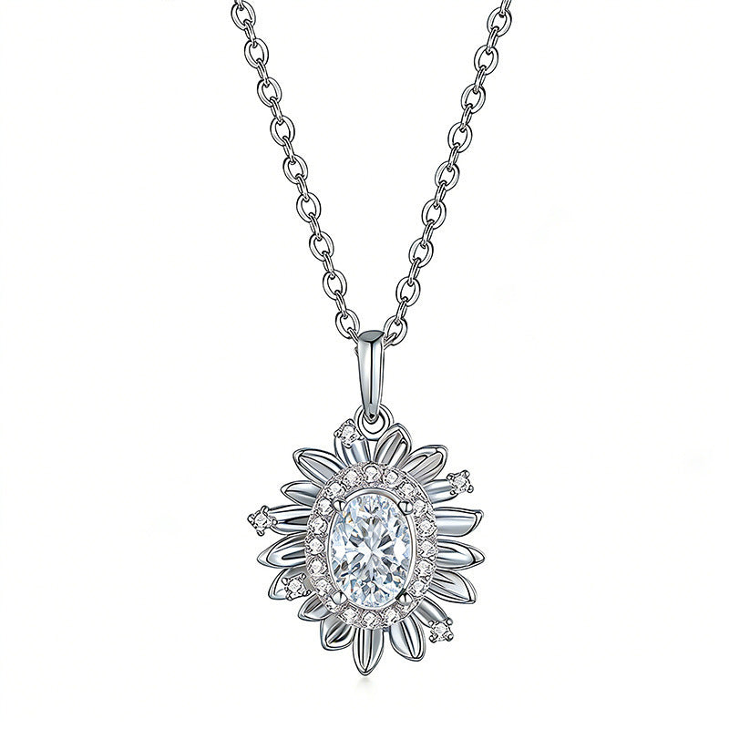 Silver necklace with a floral pendant on a white background