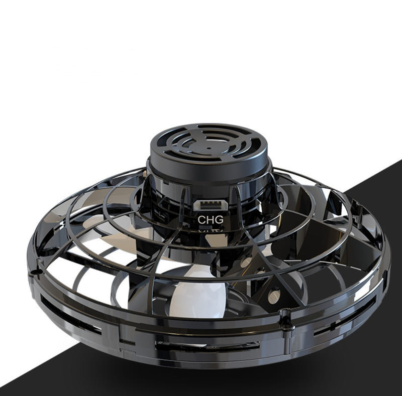 Black mini fingertip spinning toy drone with circular grille top and CHG