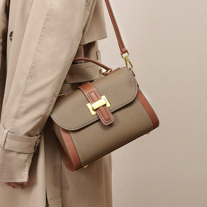 Women’s leather crossbody-style handbag in camel with front flap, contrast trim, gold buckle