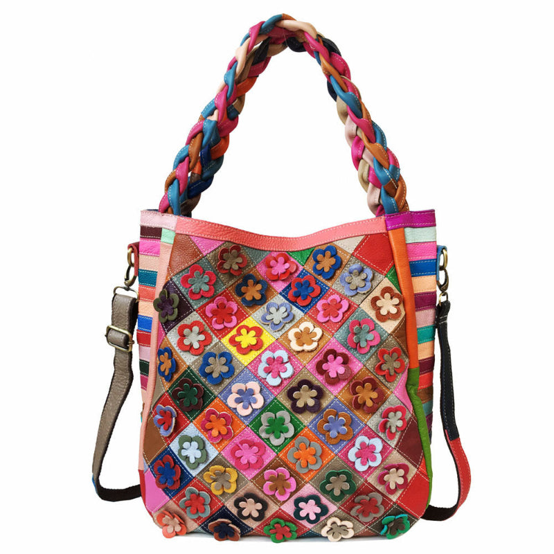 Colorful patchwork handbag with braided handle on a white background