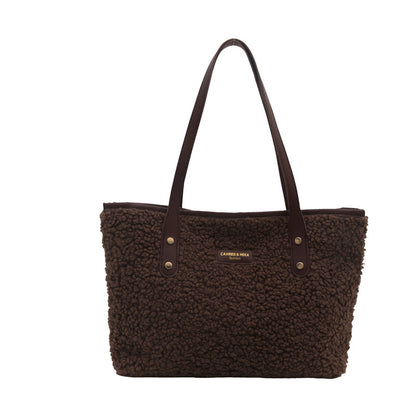 Brown furry large tote shoulder bag with long handles and button accents