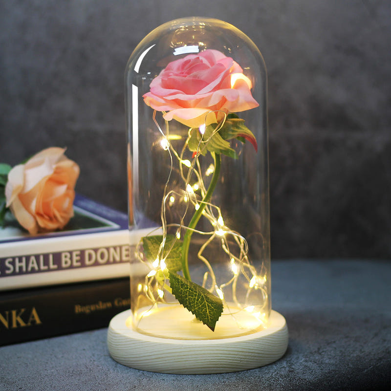 LED rose glass dome lamp with pink rose under clear dome, light beige base