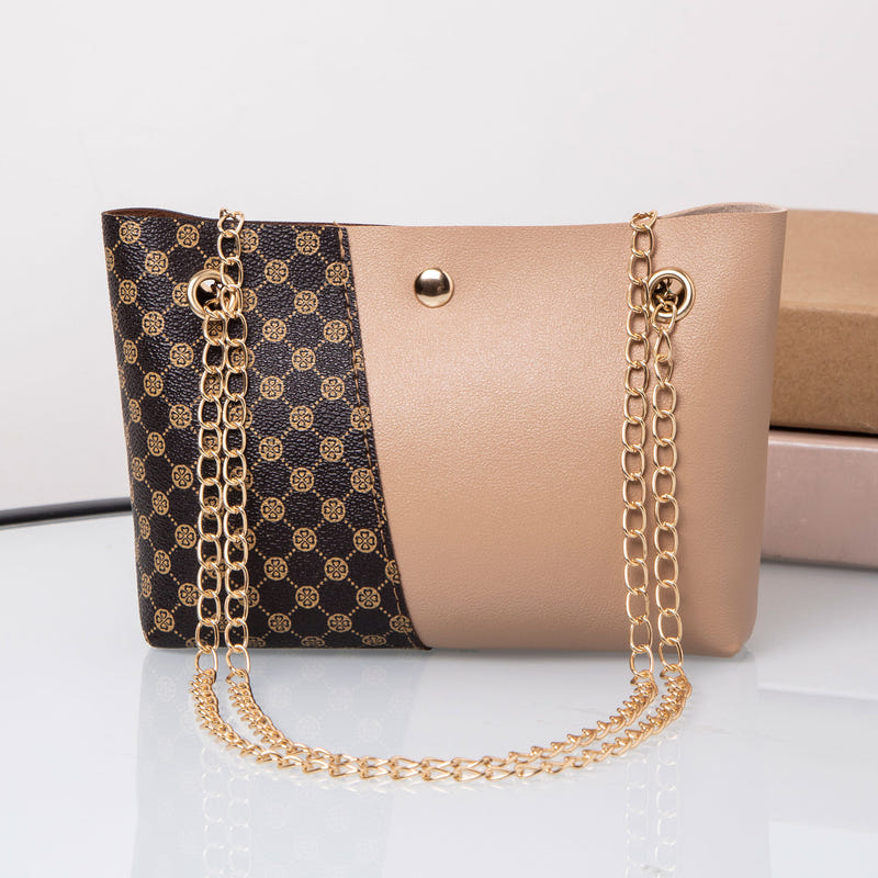 Two-tone dotted print chain shoulder bag with gold-tone hardware and double chain handles
