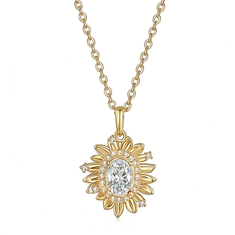 Gold necklace with a sunflower-shaped pendant on a white background