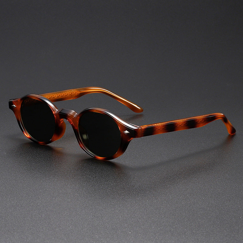 Tortoiseshell sunglasses on a gray background