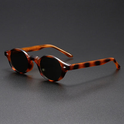 Tortoiseshell sunglasses on a gray background