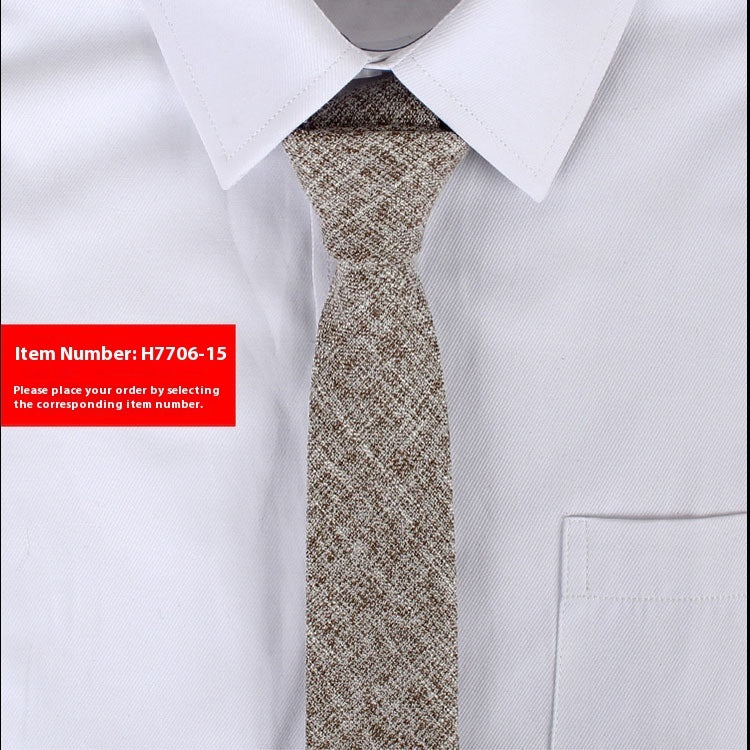 White shirt with a patterned tie and red label with item number H7706-15.