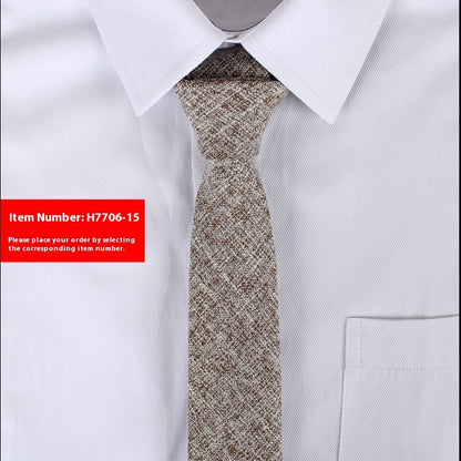 White shirt with a patterned tie and red label with item number H7706-15.