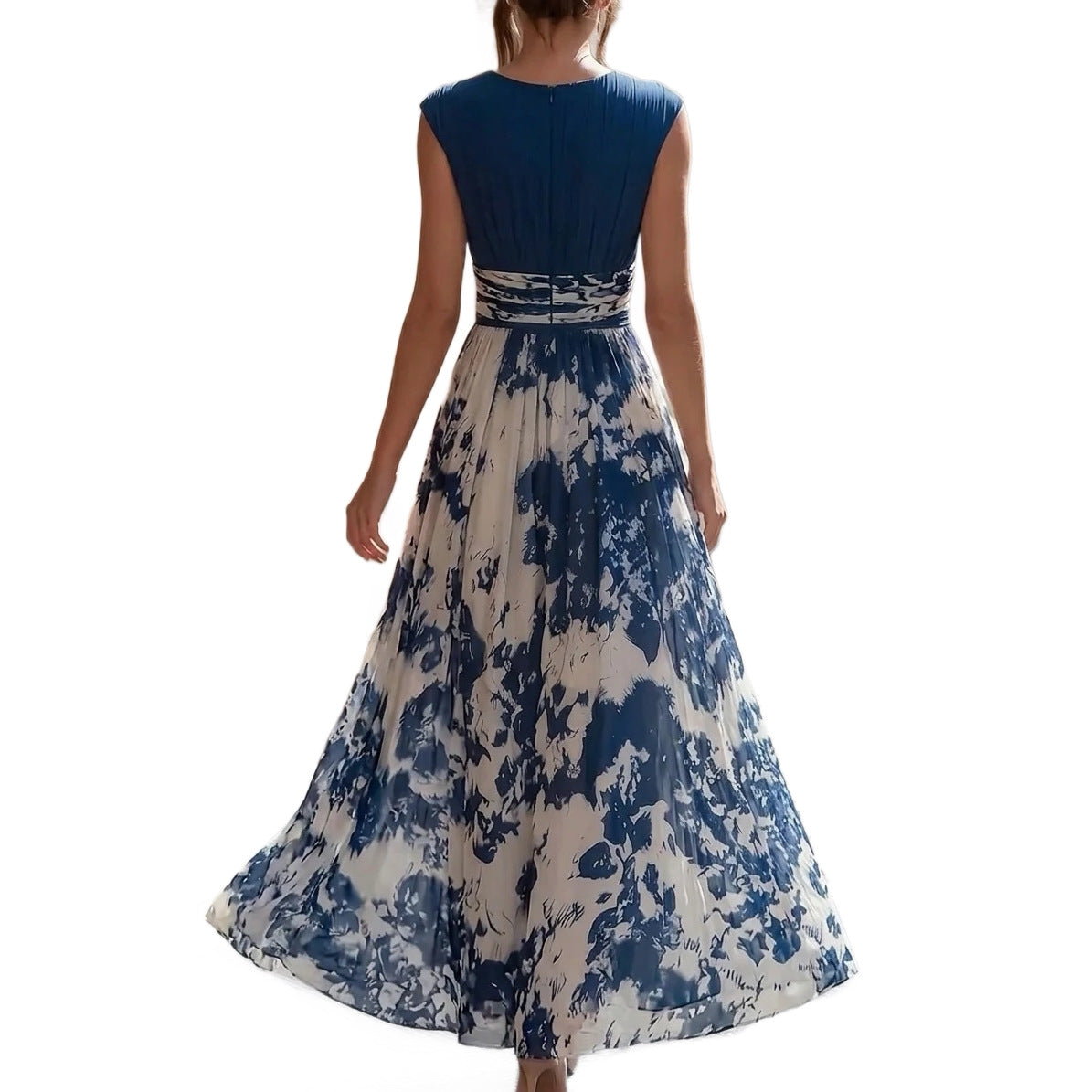Woman wearing a blue and white floral dress on a white background