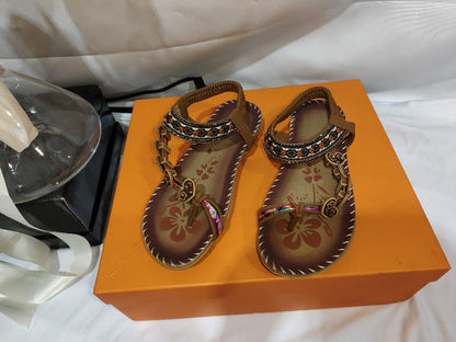 Women’s ethnic beaded sandals with rhinestone trim, pair displayed in shoe box.