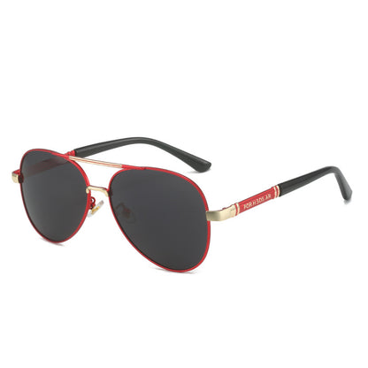 Sunglasses with red and gold frame on a white background