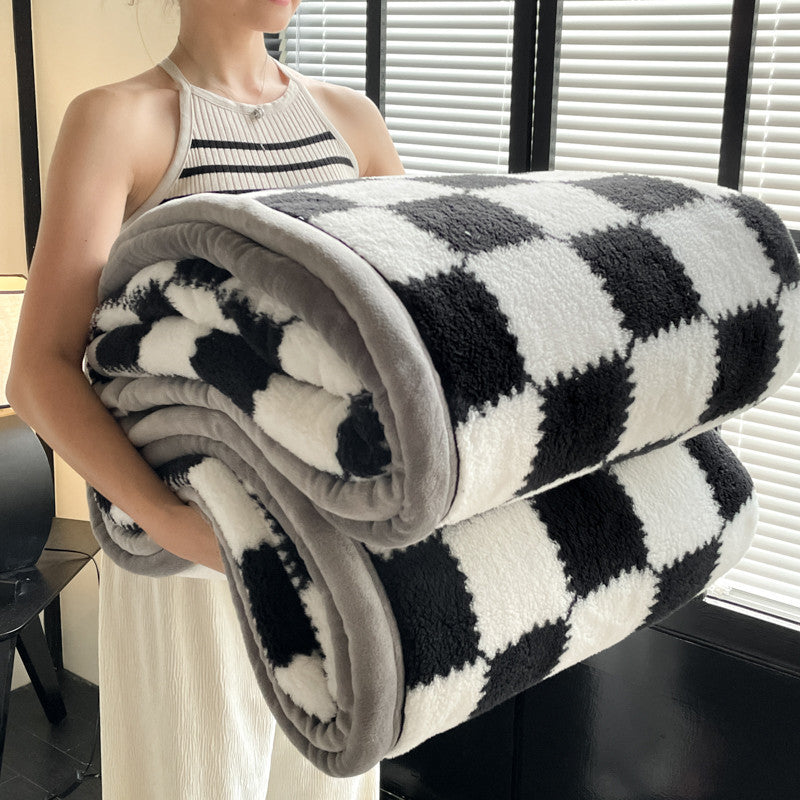 Black and white buffalo plaid fleece blanket rolled with gray border for sofa and bed