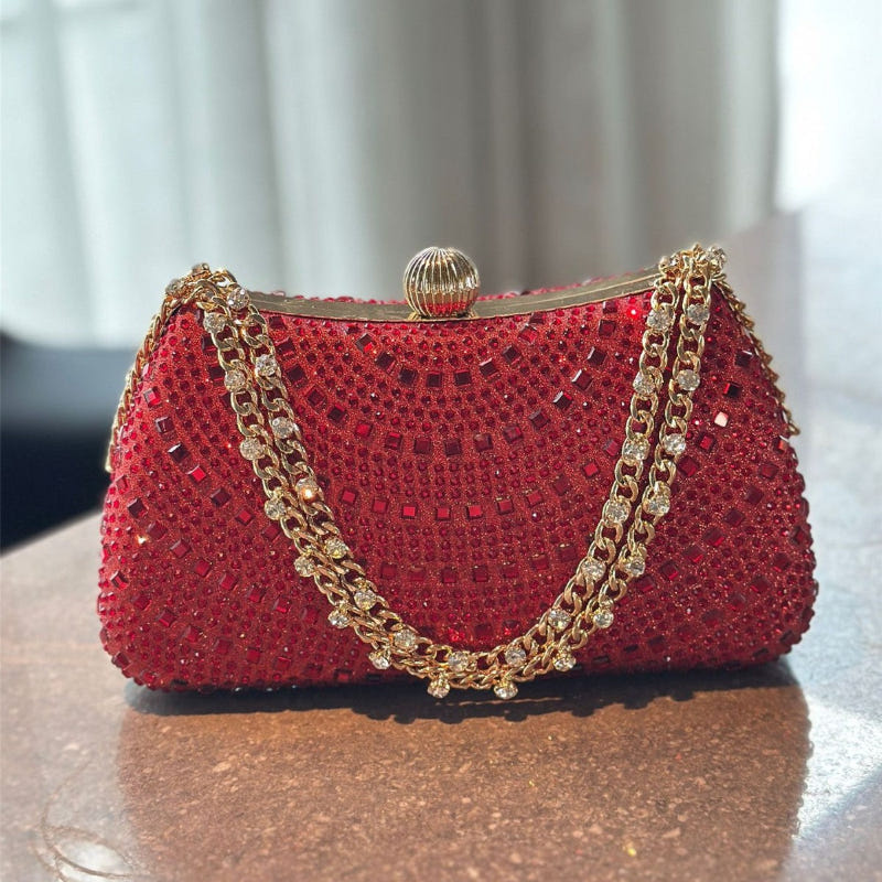 Wine red beaded clutch handbag with gold chain handles and circular top clasp