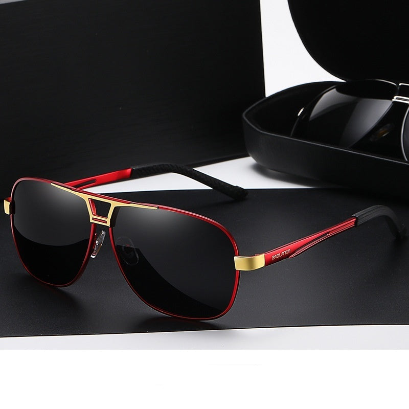 Sunglasses with red frame and gray lenses on a black surface