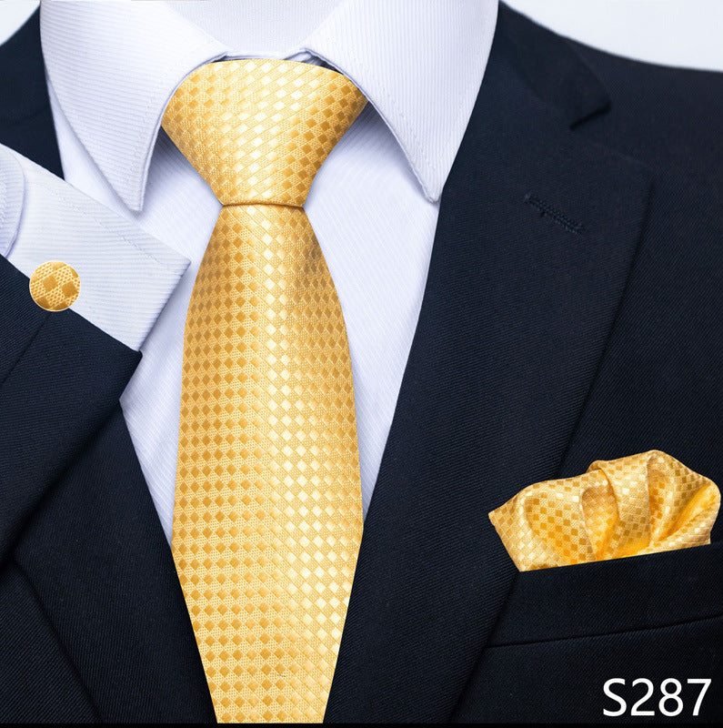 Gold tie and pocket square set with a black suit and white shirt