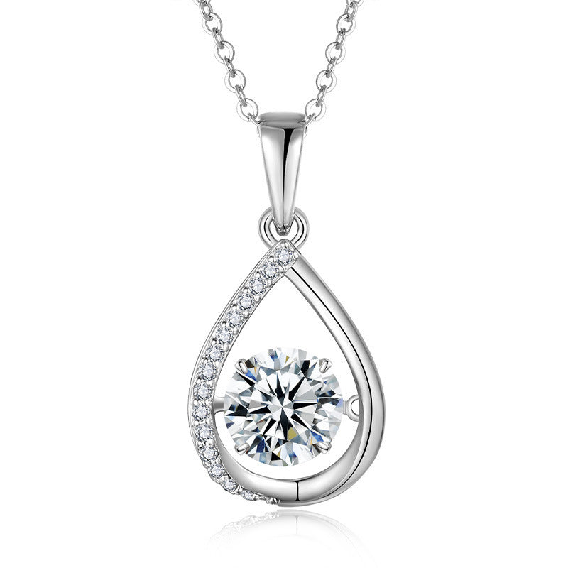 Silver teardrop-shaped pendant with a clear gemstone on a white background