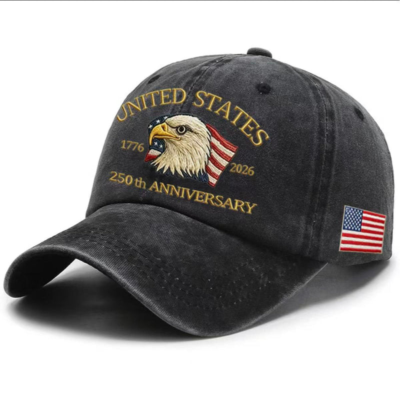 Black washed-print cap with gold “United States 1776–2026” eagle graphic and flag patch.