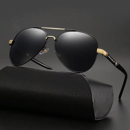 Black sunglasses with gold accents on a black background