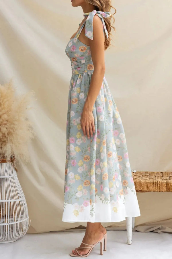 Woman wearing a floral dress with a neutral background