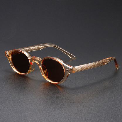 Sunglasses with brown frame and dark lenses on a gray background