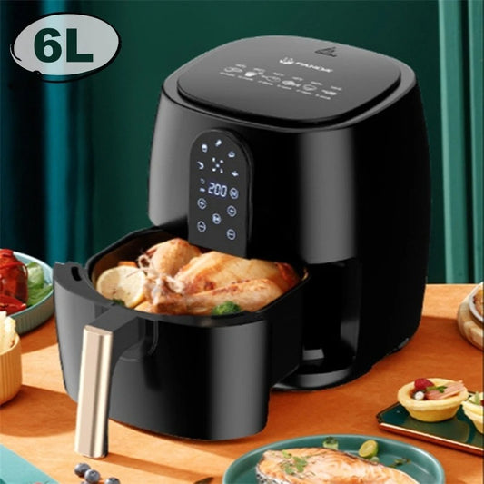 Black air fryer with food inside on a wooden table, green curtain background
