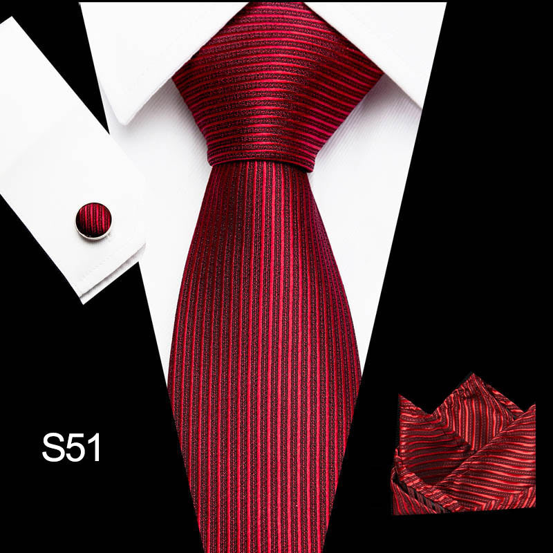 Red striped tie set with pocket square and cufflinks on a white background