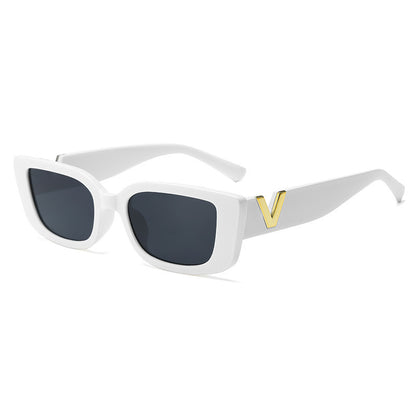 White sunglasses with a gold logo on a white background