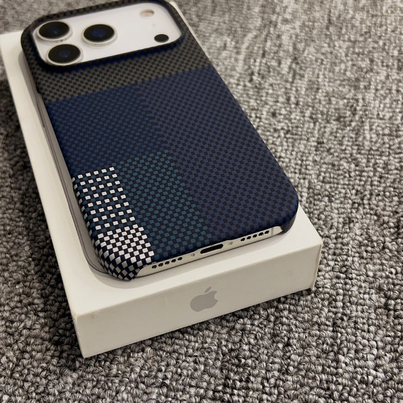 Phone case with textured design on a white box with Apple logo, on a gray carpet.