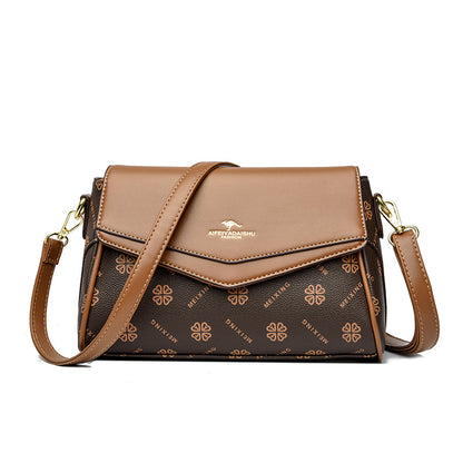 Brown handbag with floral pattern on a white background