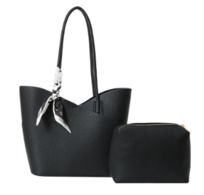 Black handbag with matching pouch on a white background